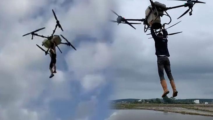 Çeltik tarlasında akılalmaz anlar! Tutunduğu dronla havalandı: Düşme anı kamerada
